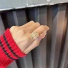 Clover spinning ring with stylish design and lucky charm